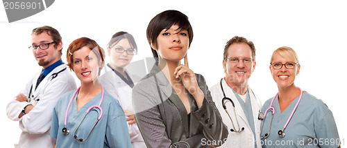 Image of Young Mixed Race Woman with Doctors and Nurses Behind