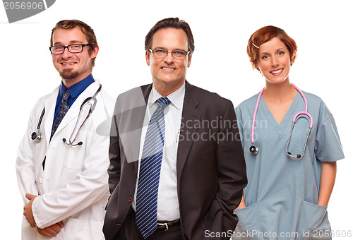 Image of Smiling Businessman with Doctors and Nurses