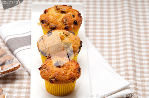 Image of fresh chocolate and raisins muffins