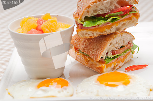 Image of ciabatta panini sandwich eggs tomato lettuce