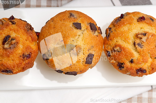 Image of fresh chocolate and raisins muffins