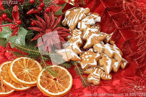 Image of christmas background with needles. orange slices and gingerbreads