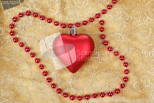 Image of red heart on christmas tablecloth