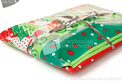 Image of christmas gift with silver ribbon
