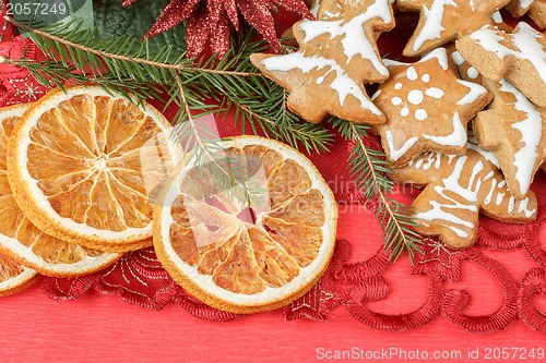 Image of christmas background with needles. orange slices and gingerbreads