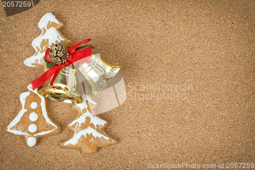 Image of corcboard with ginger bread and christmas bells