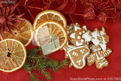 Image of christmas background with needles. orange slices and gingerbreads