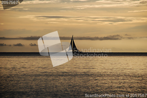 Image of Sailing boat silhouetted at sunset