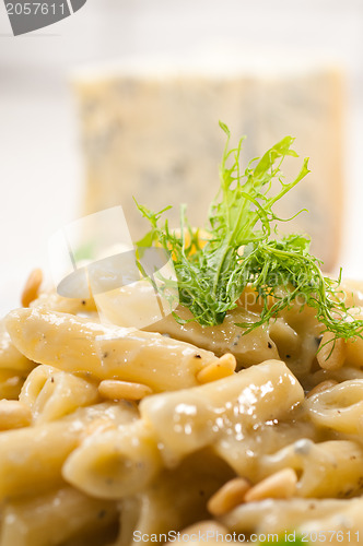 Image of Italian pasta penne gorgonzola and pine nuts