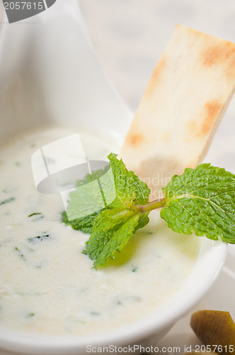 Image of Greek Tzatziki yogurt dip and pita bread