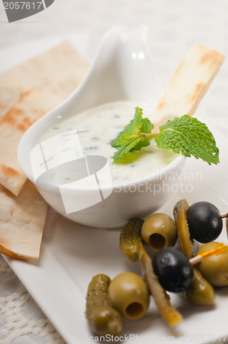 Image of Greek Tzatziki yogurt dip and pita bread