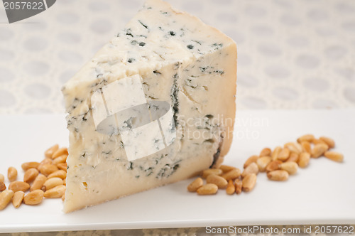 Image of gorgonzola cheese fresh cut and pinenuts