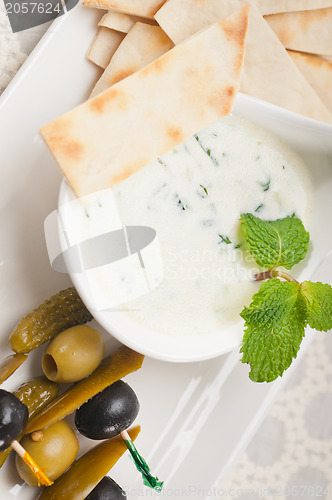 Image of Greek Tzatziki yogurt dip and pita bread