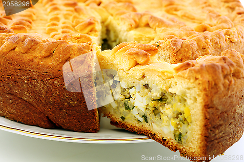 Image of Cake with eggs and greens.