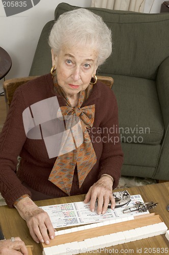 Image of senior woman at the game table