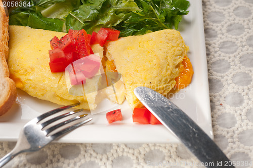 Image of cheese ometette with tomato and salad