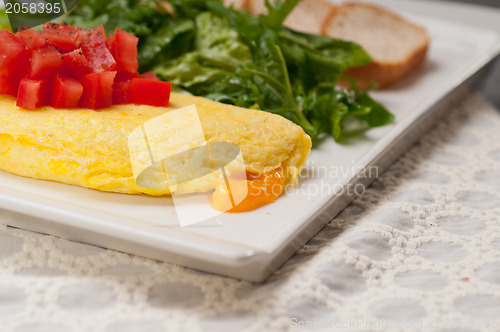 Image of cheese ometette with tomato and salad