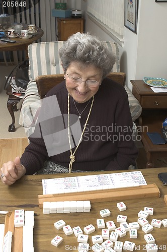 Image of senior woman at the game table