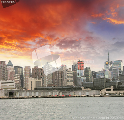 Image of Manhattan. Beautiful sky colors over New York City skyscrapers, 