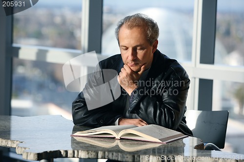Image of Man reading a book