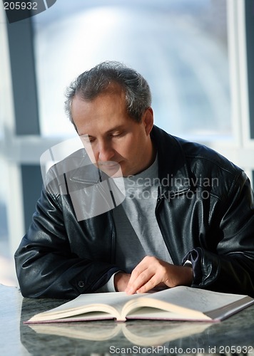 Image of Mature man reading