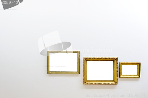 Image of Empty frames in art gallery room