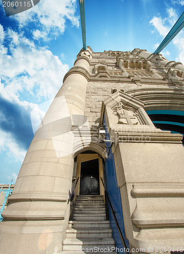 Image of Powerful structure of Tower Bridge in London with clouds in the 