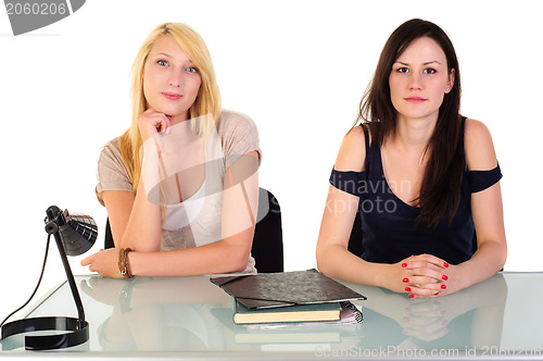 Image of Two beautiful student girls getting ready for school