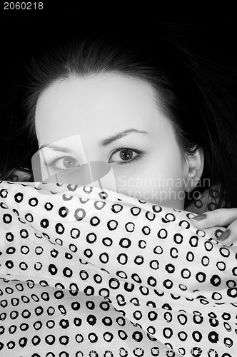 Image of Young woman in the bed