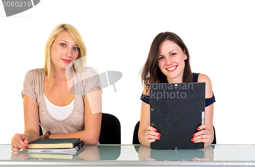 Image of Two beautiful student girls getting ready for school