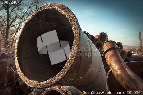 Image of Rusty old pipes stacked up