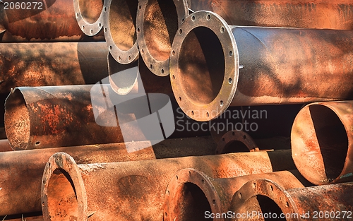Image of Rusty old pipes stacked up