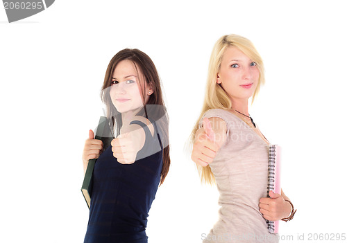 Image of Two beautiful student girls showing thumbs up