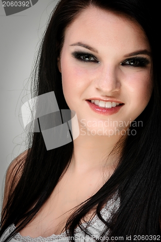 Image of Closeup of a cheerful young woman smiling