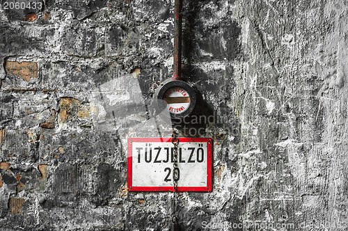 Image of Fire alarm on old brick wall