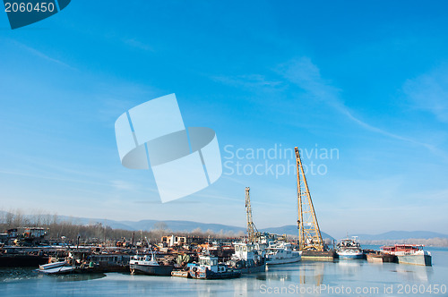 Image of Part of an industrial plant at the shores of a river