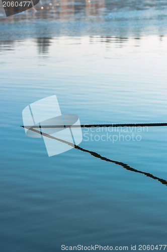 Image of Abstract photo of a cable in the water