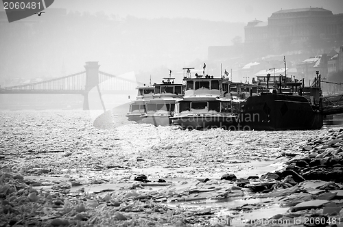 Image of Big boats stuck in the ice at winter