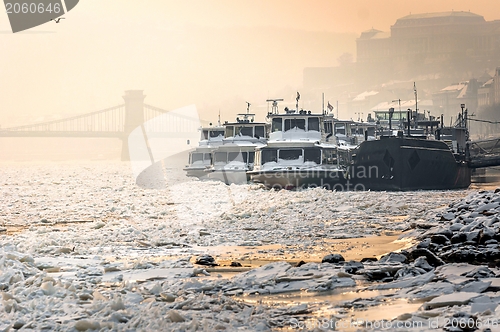 Image of Big boats stuck in the ice at winter