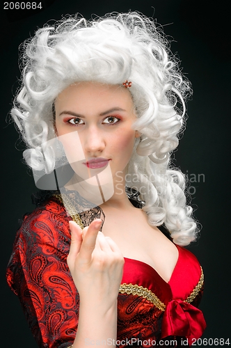 Image of Young woman in baroque costume