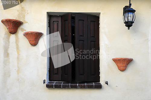 Image of Window With Brown Shutters