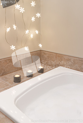Image of Bathroom decorated with cozy lights and candles
