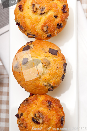 Image of fresh chocolate and raisins muffins