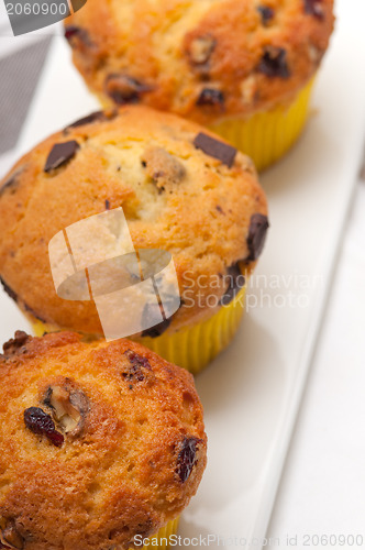 Image of fresh chocolate and raisins muffins