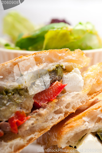 Image of ciabatta panini sandwichwith vegetable and feta