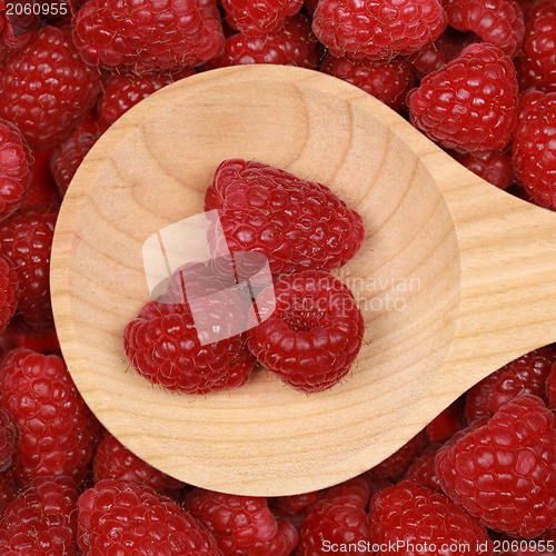 Image of Raspberries on a wooden spoon