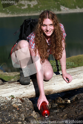 Image of Bailing water from a brook