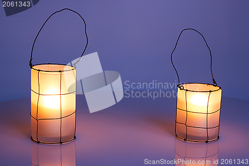 Image of Two cozy lanterns in twilight