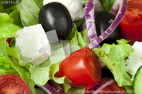 Image of Salad in a glass bowl close up. 
