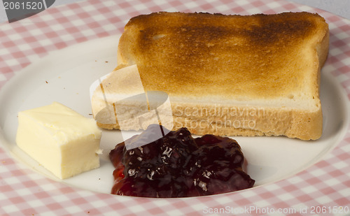 Image of Jam, butter and toast.